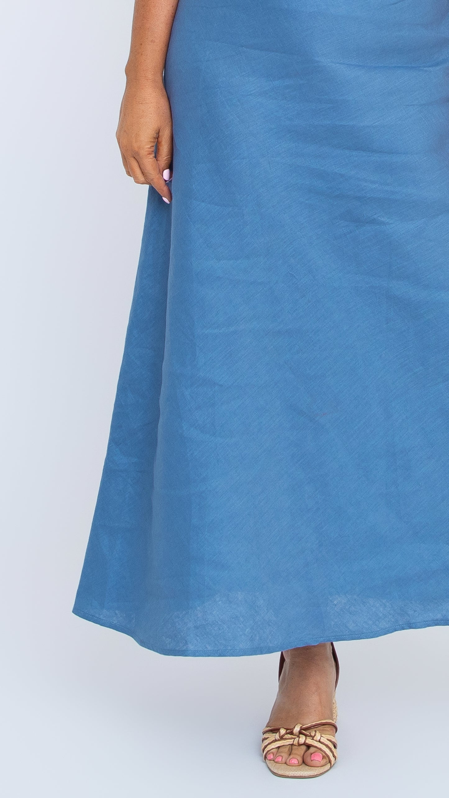 Close up view of Sarah-Jane linen bias cut skirt in coronet blue by Nancy The Label
