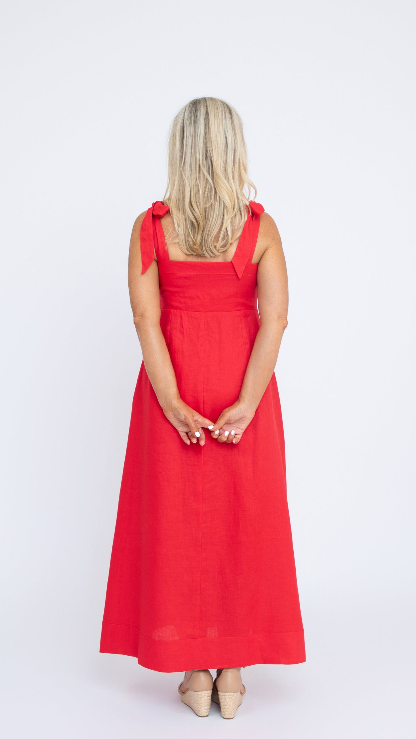 Isabelle Linen Dress in Crimson Red by Nancy The Label. Full length linen dress with square neckline and self-tie straps. Back view.
