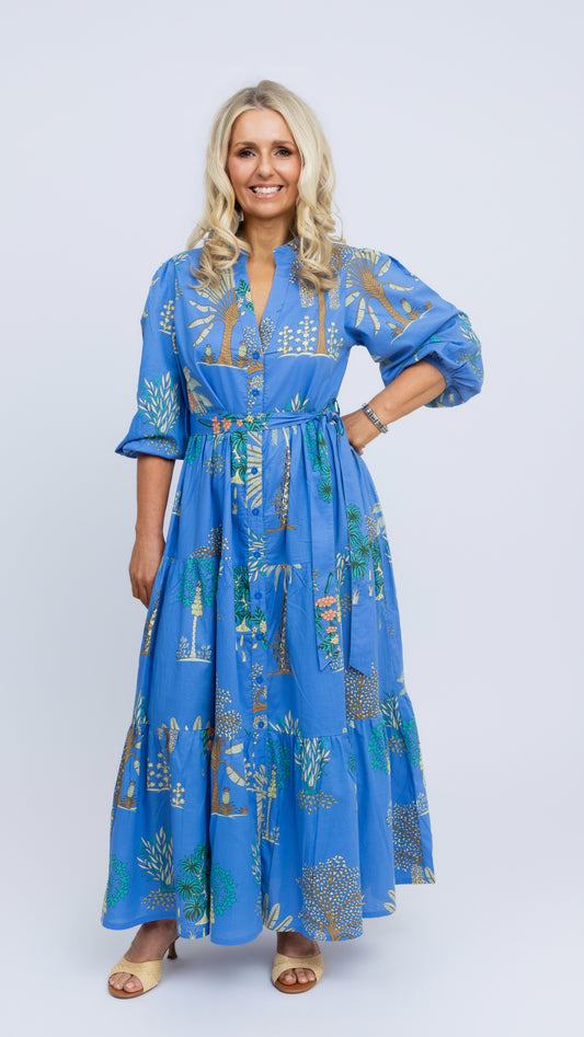 Model wearing the Mandy maxi dress by Nancy The Label in blue Arboretum print, made from 100% cotton, front view.